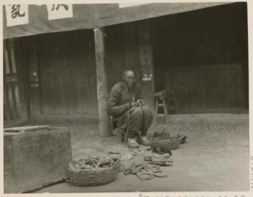 Shoe cobbler working outside