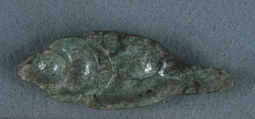 Jadeite ornament carved in the shape of a half shell