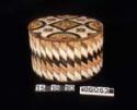 Birchbark box, ornamented with quillwork. Circular box with soft wood base pegge