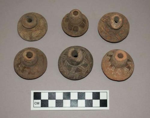 Ceramic spindle whorls, round, incised decoration