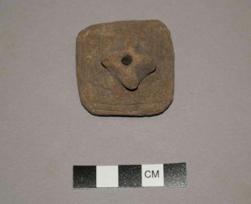 Terra cotta spindle whorls ornamented with incised lines