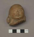 Ceramic, earthenware effigy figurine fragment, mold-made human head with earspools