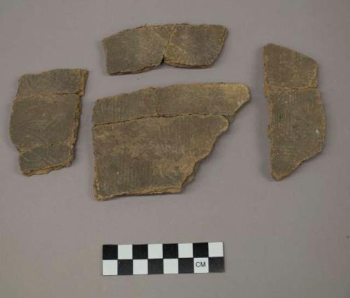 Conjoined rectilinear complicated stamped rim and body sherds