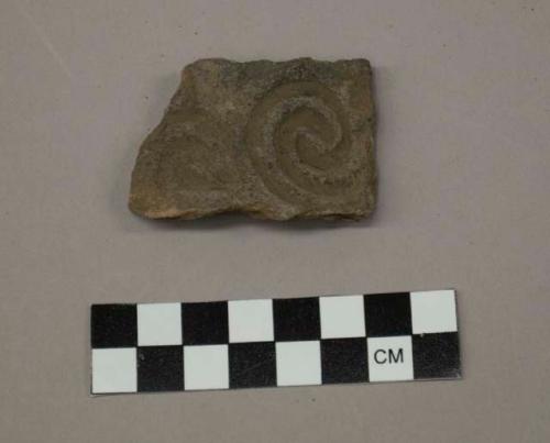 Curvilinear complicated stamped body sherd
