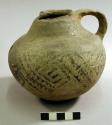 Black on white pottery jug