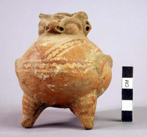 Tripod bird effigy.  Red slip with painted red lineal motif outlined in white wi