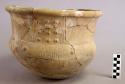 Ceiba Red and Brown Incised pottery jar.  Incised parallel lines and raised punctation (coffee beans?). Thick lip with red slip. Handles in form of armidillos.