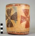 Terra cotta vase, decorated with 4 crosses in red and black