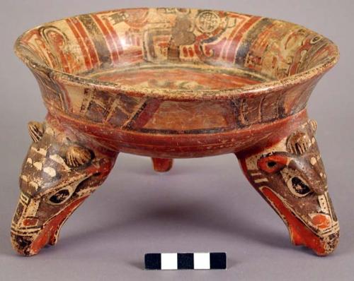 Nicoya Polychrome tripod vessel with eagle head rattle legs and crab (?) design