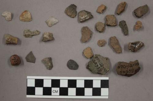 7 fragments quartz and limestone; 16 fragments unglazed pottery; 11 fragments st