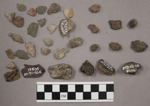 6 fragments limestone; 10 fragments unglazed pottery; 16 fragments stone