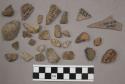12 fragments quartz and limestone; 4 fragments unglazed pottery; 2 fragments gla