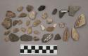 17 fragments quartz and limestone; limestone pebble; 74 fragments stone; 4 fragm