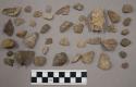 19 fragments quartz and limestone; 6 fragments unglazed pottery; 81 fragments st