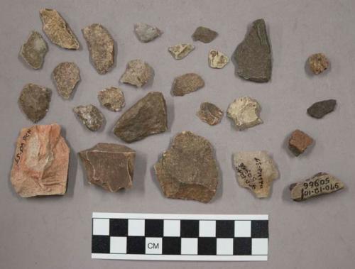 23 fragments quartz and limestone; 4 fragments unglazed pottery; fragment bone;