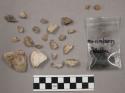 28 fragments quartz and limestone; 2 fragments stone; 2 fragments soft, yellow r