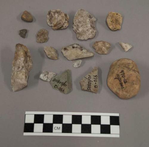 16 fragments limestone and quartz; 2 limestone pebbles; 23 fragments stone