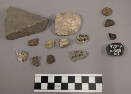 9 fragments stone; 7 fragments limestone; 2 fragments coal-like material; 2 frag