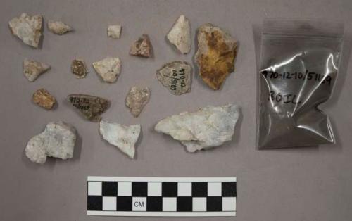 27 fragments quartz and limestone; sample earth; 4 fragments stone chips; 1 smal