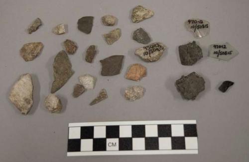 2 fragments glass; 11 fragments unglazed pottery; 3 fragments coal-like substanc