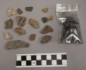 1 fragment glass; 3 fragments unglazed pottery; fragments charcoal; 26 fragments