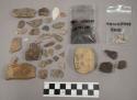 44 pcs quartz and limestone; 6 fragments bone; 1 fragment unglazed pottery; frag