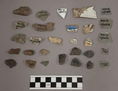 Chipping waste, quartz, shell?, 5 pottery, 1 glass, 4 glass fragments