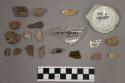1 animal tooth?; 18 fragments stone; 2 fragments glazed pottery; 2 fragments ung