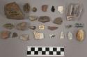 3 flat and bottle glass fragments, 7 earthenware sherds, 1 kaolin pipe bowl fragment, 2 projectile points, 1 brick fragment, 29 pieces of stone chipping debris, 1 piece mica, and 3 shell fragments