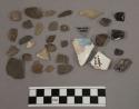 3 fragments charcoal; 1 fragment glass; 1 fragment glazed pottery; 2 fragments b