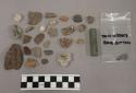 1 button, 12 fragments quartz and limestone; 7 fragments unglazed pottery; 36 st