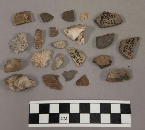 5 fragments unglazed pottery; 14 fragments quartz and limestone; 24 fragments st