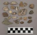 26 fragments quartz and limestone; 4 fragments unglazed pottery; 34 stone fragme