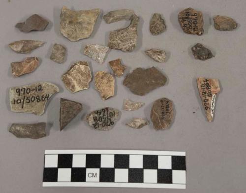 28 stone fragments 17 fragments limestone and quartz 3 fragments unglazed potter