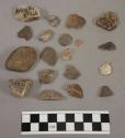 21 fragments quartz and limestone; 2 fragments pottery; 1 fragment bone; 1 pebbl