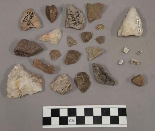 61 fragments stone; fragment unglazed pottery; 3 fragments bone; 23 fragments qu