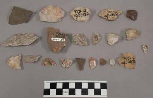 30 fragments quartz and limestone; 2 fragments bone; 1 fragment unglazed pottery