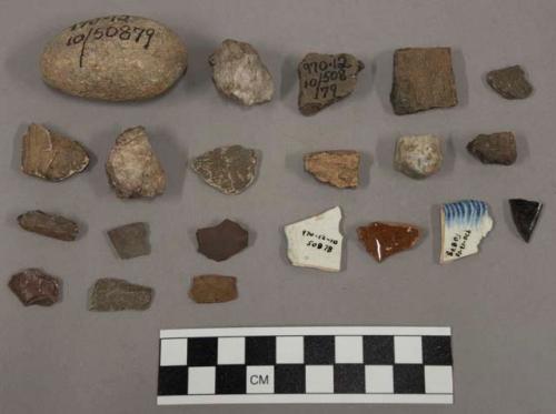 14 fragments quartz and limestone; 3 fragments glazed pottery; 41 fragments ungl
