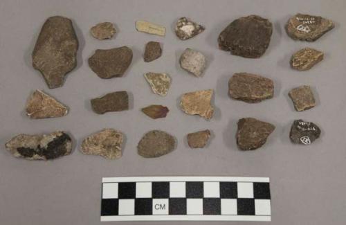 7 fragments quartz and limestone; 13 fragments unglazed pottery; 38 fragments st