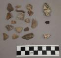 32 fragments quartz and limestone; 1 fragment bone; 1 fragment charcoal; 72 frag