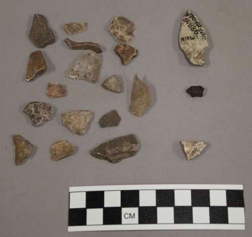32 fragments quartz and limestone; 1 fragment bone; 1 fragment charcoal; 72 frag
