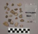 28 fragments quartz and limestone; 70 fragments stone
