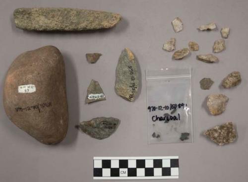 100 fragments quartz and limestone; 31 fragments stone; fragments charcoal