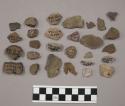 7 fragments quartz and limestone; 15 fragments unglazed pottery; 1 pebble; 31 fr