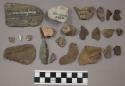 33 fragments quartz and limestone; 85 fragments stone; 2 fragments bone; 2 bifac