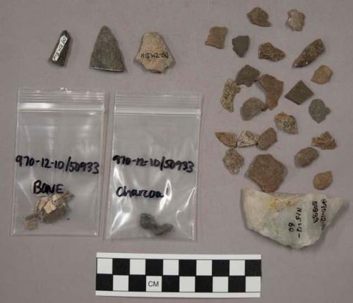 40 fragments quartz and limestone; 106 fragments stone; bone and charcoal fragme