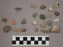 6 fragments limestone; 4 fragments unglazed pottery; 11 fragments stone