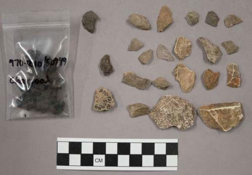 17 fragments quartz and limestone; 3 fragments unglazed pottery; 44 fragments st