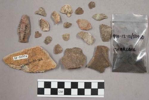 24 fragments quartz and limestone; 45 fragments stone; fragments charcoal; 2 fra