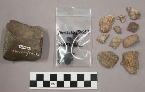 39 fragments quartz and limestone; 15 fragments stone; fragments charcoal; 1 fra